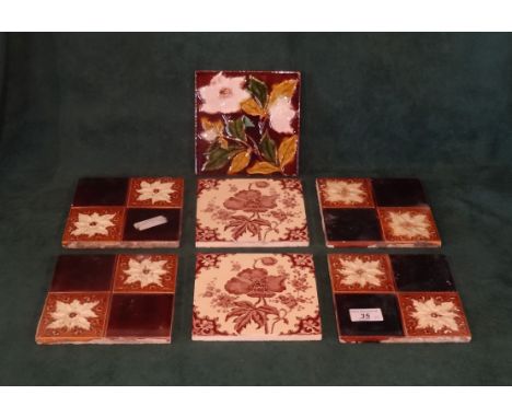 Seven Victorian ceramic tiles, to include: five Majolica examples and a pair of printed tiles, each of foliate design (15.5cm