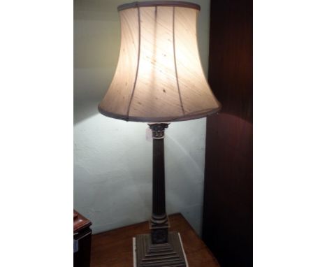 A contemporary table lamp of Corinthian column form on stepped square base (83cm to include shade).
