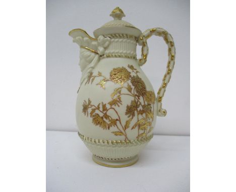 A late 19th century Royal Worcester ovoid jug and cover with a female mask spout, decorated with gilt and chrysanthemums on a