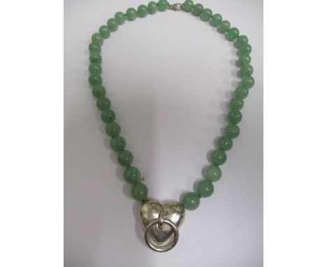 A Tiffany &amp; Co jade and silver necklace, with a hart and ring pendant 18" l 
