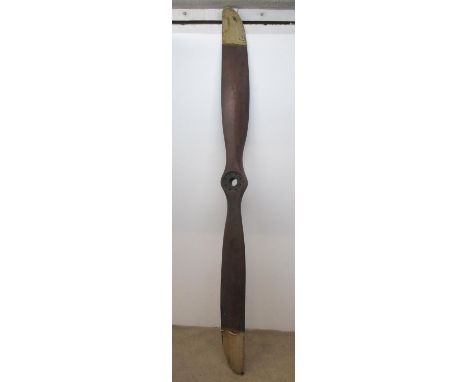 An Avro wooden propeller from a 80HP Clerget engine, circa 1915, 2744 dia with Avro transfers and canvas tips "h 