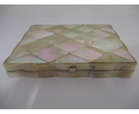 A Victorian mother of pearl card case of rectangular form with a silver coloured metal panelled front, with engraved and engi