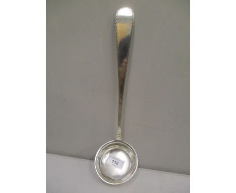 A white metal serving ladle inscribed 'Otto Peters Kiel 800', 13 1/2" long 