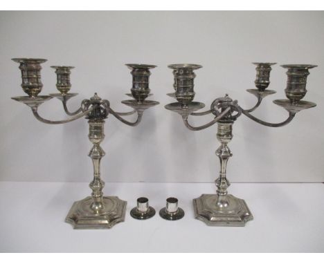 A pair of Victorian silver four branch candelabra by Elkington &amp; Co, Birmingham, the base hallmarked for 1893, four light