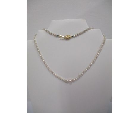 A Tiffany &amp; Co 18ct gold and pearl necklace, the clasp decorated with six letter T, 15 1/4" l 