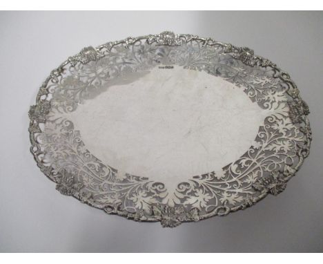 A silver oval dish, by Gladwin Ltd Sheffield 1938  with cast grape and vine edge and a leaf, pierced border, on a foot ring, 