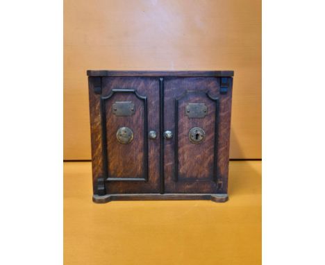 Novelty oak tea caddy in the form of a safe, standing 24cm tall.