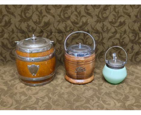 Oak biscuit barrel and tea caddy together with a pale green glass condiment pot.
