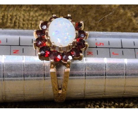 9ct gold opal and ruby dress ring, size L, opal 8mm.