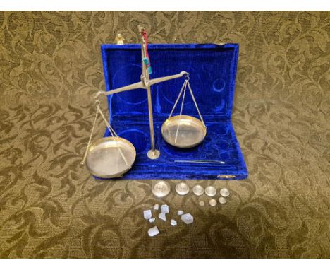 Cased set of brass balance scales and weights. Weights up to 50 grams.