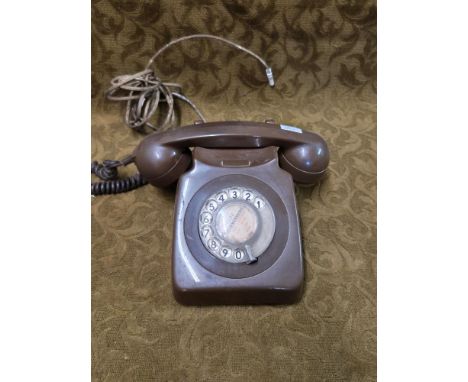 Vintage brown BT rotary dial telephone.
