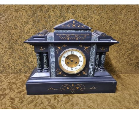 Late Victorian slate mantle clock with marble columns and insert and painted gilt decoration.  Brass and enamel Roman numeral