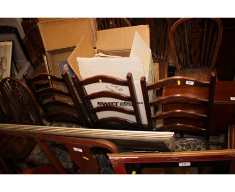 A set of four oak ladder back dining chairs 