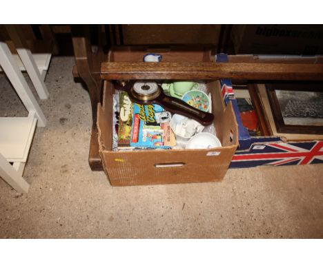 A box containing Giles annuals; a small barometer; crested china; a Noddy alarm clock; various pottery items etc.