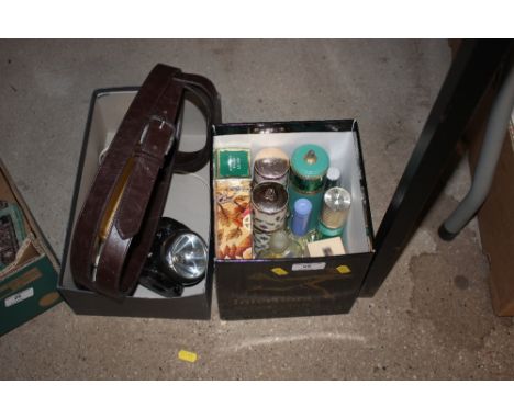 A box of scent and perfume bottles; together with a box containing a brown leather belt, a telephone, and a bicycle lamp 