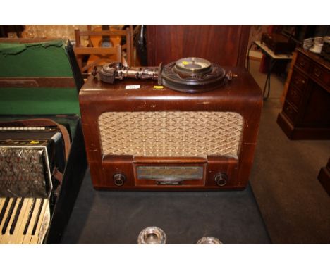 A walnut case radio and barometer