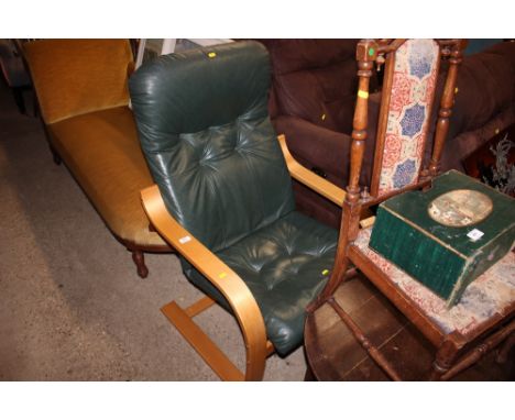 A green leather button back and bent wood armchair 