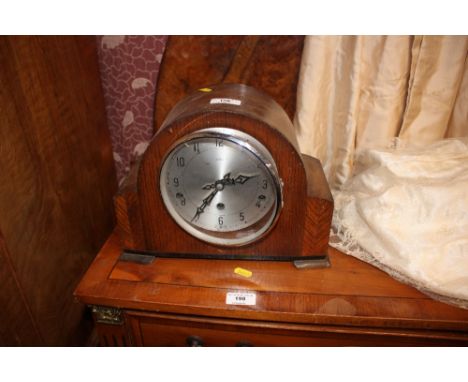 An Enfield oak cased three hole mantel clock