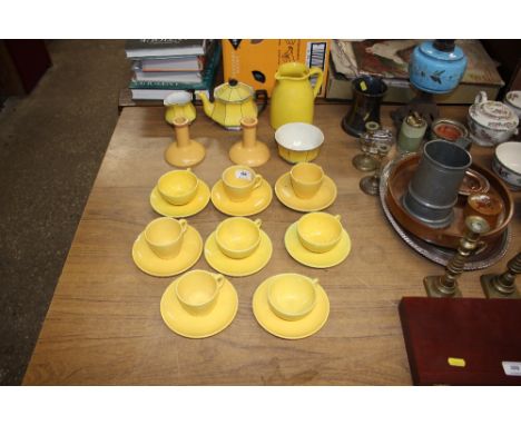 A quantity of French yellow glazed coffee cups and saucers; an Art Deco style teapot and cream jug etc. 