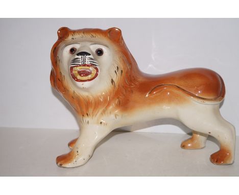 Victorian ceramic figure of a lion. 33cm