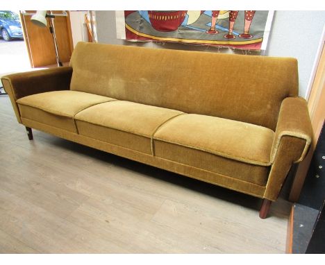 A 1940's Danish three seater sofa with original green velor upholstery, raised on short tapering legs. 206cm x 80cm x 75cm hi