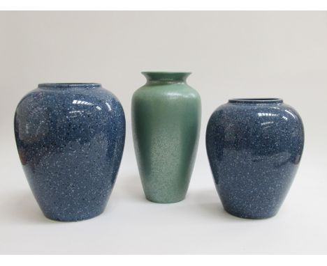 A Poole green mottled lustre glaze vase and two blue TG Green speckled vases 