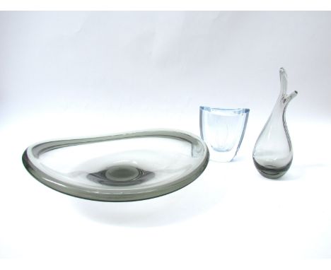 A Holmegaard Per Lutken smoked glass shallow bowl, 29cm diameter, a Holmegaard Per Lutken 1957 smoked beaked bud vase, 19.5cm