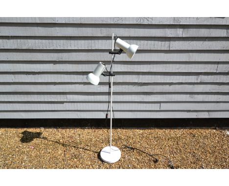 A white standard lamp with twin adjustable spots