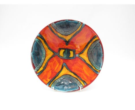 A Poole Pottery bowl by Anita Harris in the 'Peacock' pattern. 7cm high x 27cm diameter