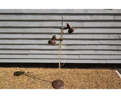 A standard lamp with twin adjustable brown and chrome spots