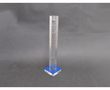 A Kosta Boda clear glass candle stick by Bertil Vallien, textured square column with blue drip tray (loose) square base with 
