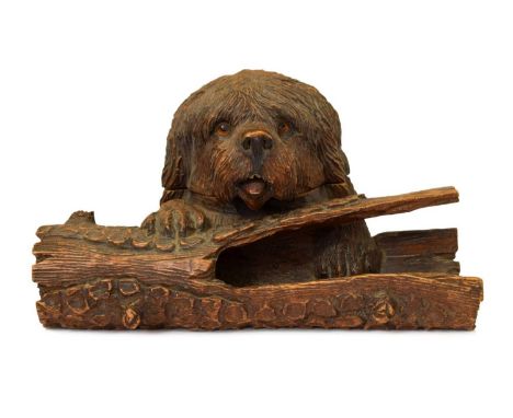 Late 19th century Black Forest carved linden wood inkstand, formed as the head of a terrier dog, hinged and enclosing a glass