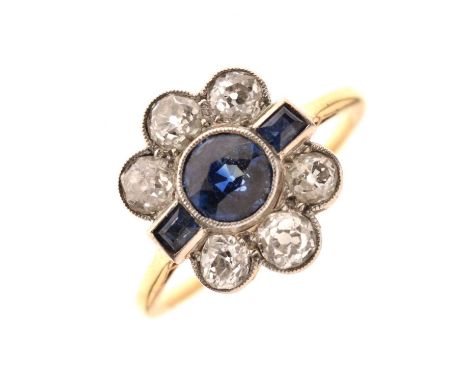 Art Deco sapphire and diamond flower head cluster ring, the central round mixed cut sapphire measuring approx 4.90mm x 4.90mm