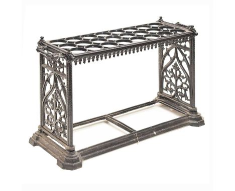 Late Victorian cast iron umbrella or stick stand, the rectangular frame with three rows of eight divisions, the sides with tw