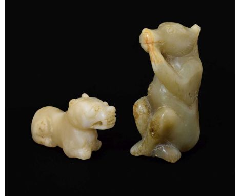 Two Chinese carved jade animals, probably late Qing dynasty circa 1900, the larger perhaps a 'zodiac animal', with the head o