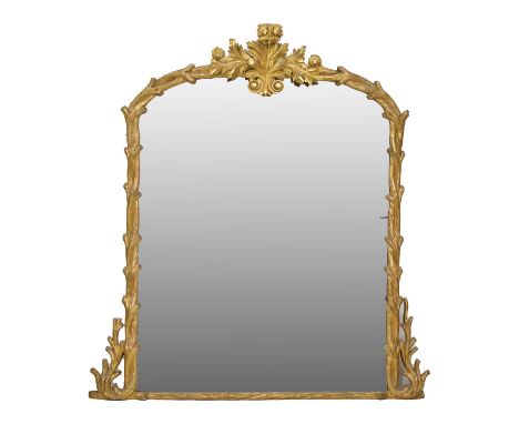 Mid-Victorian giltwood overmantel mirror, the shallow arch mirror plate enclosed within naturalistically carved tree branch s