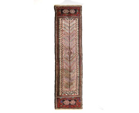 Middle Eastern wool runner, probably Afghan Baluchi, the ivory field decorated with a stylised flowering plant with alteratin