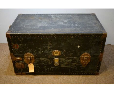 A 20th Century wardrobe travel trunk, the hinged rectangular top with close nail decoration enclosing a fitted interior with 