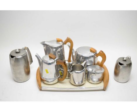 An aluminium Picquot ware tea and coffee service, comprising: teapot, coffee pot, hot water jug, milk, sugar and cream, on a 