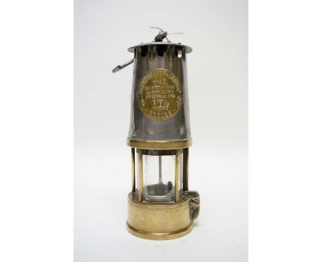 The Protector Lamp &amp; Lighting Co. Ltd., Type SL safety miner's lamp by Eccles, with polished steel bonnet, 25cms high.