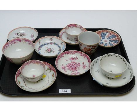 A small quantity of late 18th Century Chinese Export tea bowls and saucers, including: an iron red decorated beaker; a whirl 