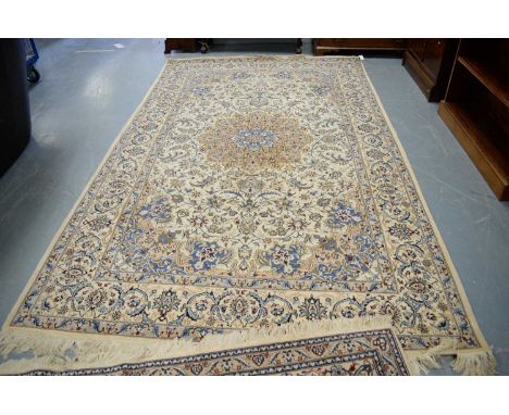 A modern Isfahan carpet, with ivory ground and central medallion issuing trailing vines, contained within a border of repeati