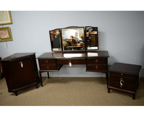 A Stage dressing table, the triptych mirror above a rectangular moulded top with central frieze drawers, flanked by two banks