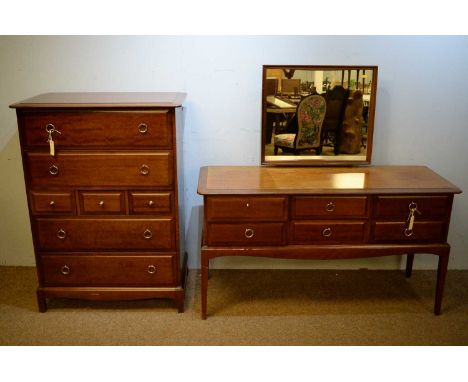 A Stag bedroom suite, comprising a dressing table, the rectangular top with square cushion moulded mirror above a rectangular