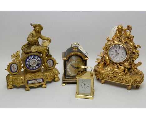 A late 19th Century gilt spelter clock case, decorated with a cavalier above a drum movement, porcelain painted face applied 