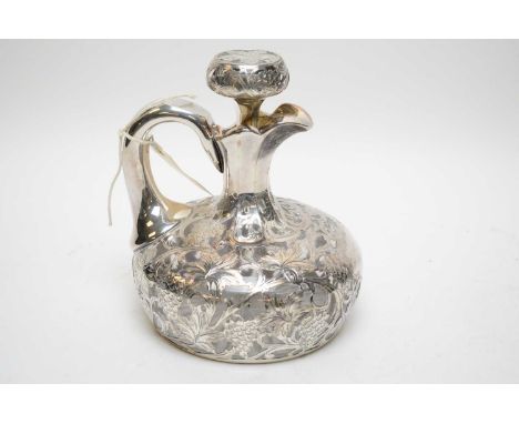 A silver plate overlay cut glass decanter of compressed globular form, decorated with pendant fruiting vine and vacant cartou