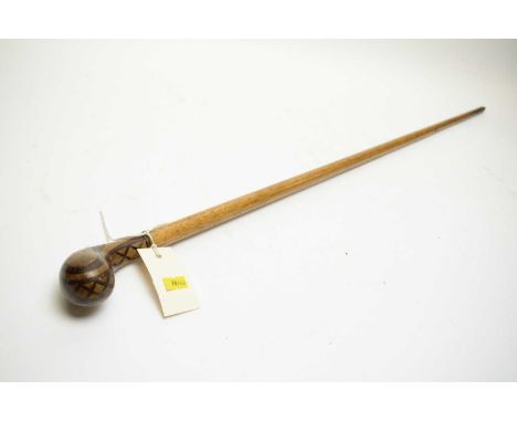 A 19th Century Sunday stick golf club, the head inlaid with lattice decoration, in probably ebony and beech, on hickory shaft