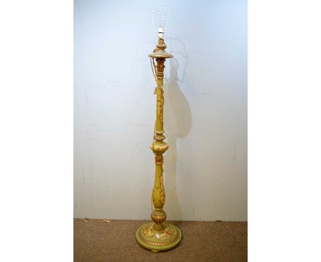 A 20th Century painted standard lamp, with turned acanthus clasped column, painted in olive with floral cartouches, raised on