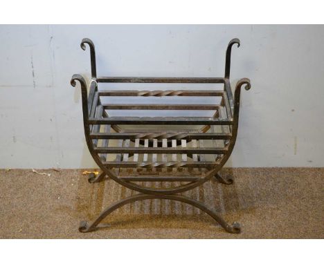 A cast iron fire basket with scroll uprights, 66 x 62.5 x 33cms; together with a copper log bucket and fire tools including a