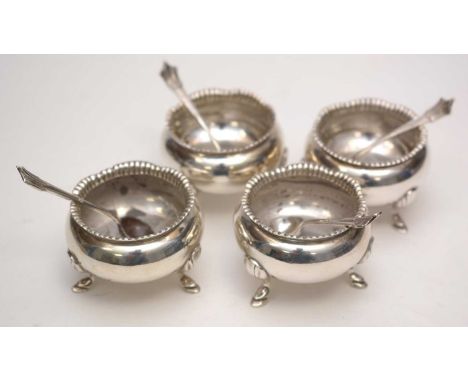 A set of four silver cauldron pattern salts, by Henry Wilkinson &amp; Co. Ltd., London, 1900, with matching salt spoons, 5cms